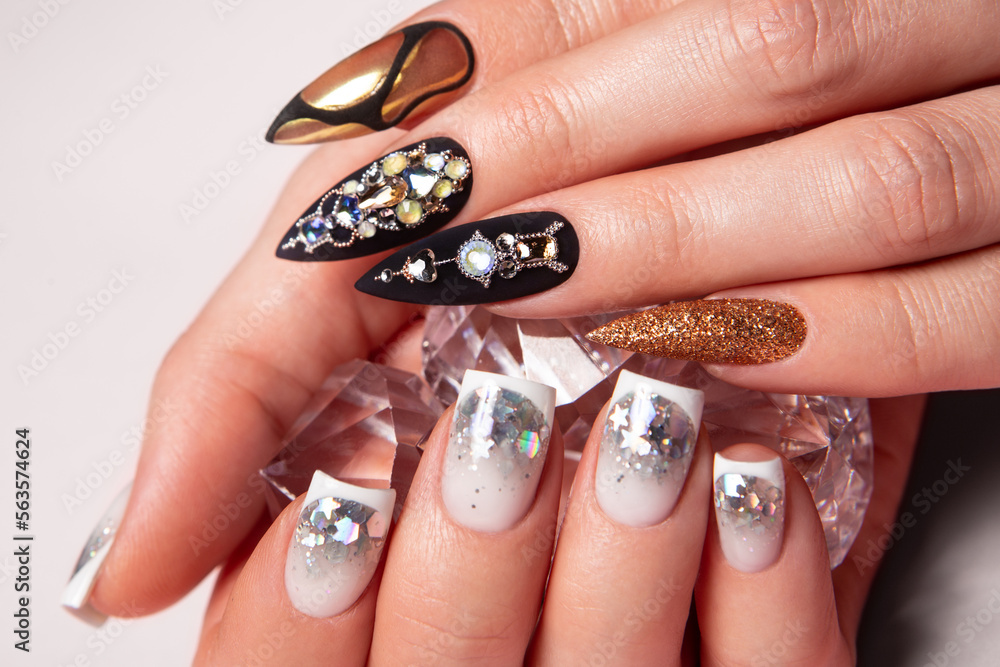 Two different manicures, black and white. Two different manicures, black and white.