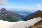 Reservoir Wasserfallboden and mountain snow panorama with summit Kitzsteinhorn in Glockner Group, Austria