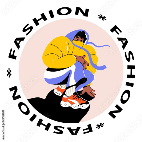 The stylish guy is squatting. Modern street fashion. Sports sneakers on a young man