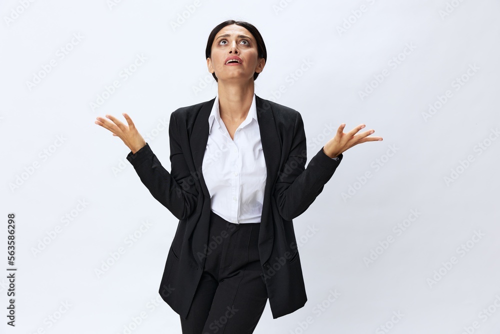 Business woman in black business suit shows signals gestures and emotions on white background, freelancer job online time management, teacher science Business woman in black business suit shows signals gestures and emotions on white background, freelancer job online time management, teacher science