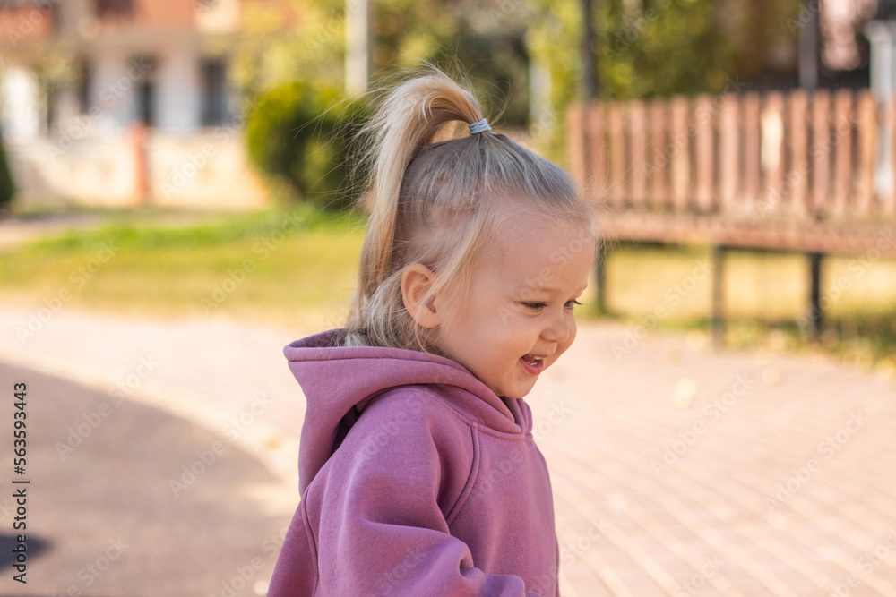 A happy girl smiling on kids playground A happy girl smiling on kids playground
