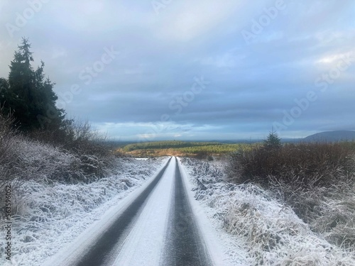 Snow covered icy road through the countryside of co Sligo, Ireland © liam