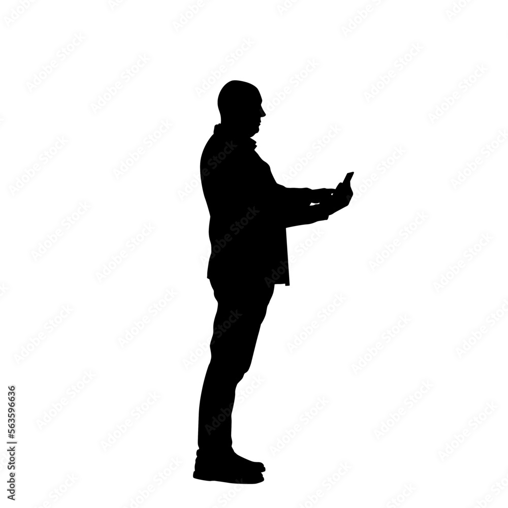 Silhouette of a man using a cell phone