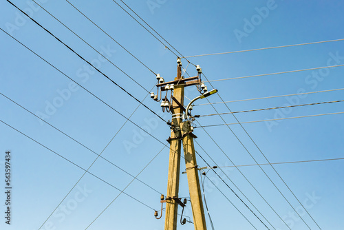 Power electric pole with line wire on colored background close up