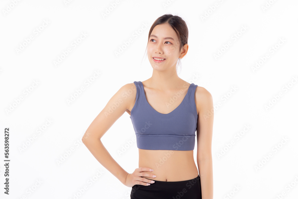 Portrait of beautiful young asian woman in sportwear smile and showing waist and abs isolated on white background, sport and exercise for health, female slimming with confident and wellness Portrait of beautiful young asian woman in sportwear smile and showing waist and abs isolated on white background, sport and exercise for health, female slimming with confident and wellness