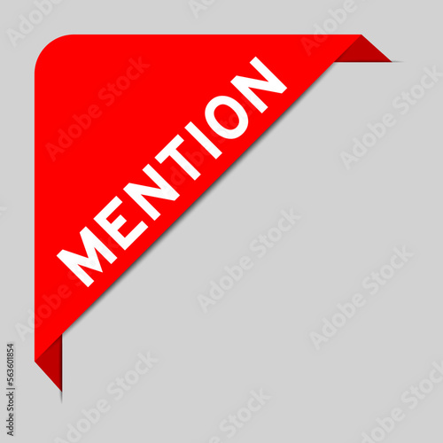 Red color of corner label banner with word mention on gray background