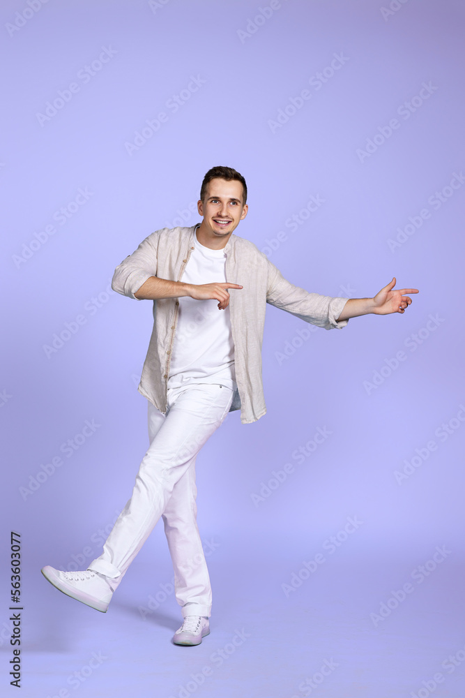 happy man walks isolated on violet background. happy man walks isolated on violet background.
