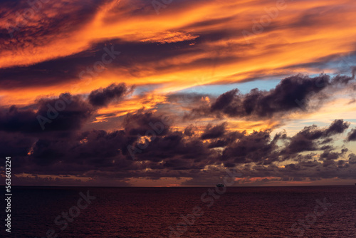 Dramatic sunset sky over the calm ocean. 