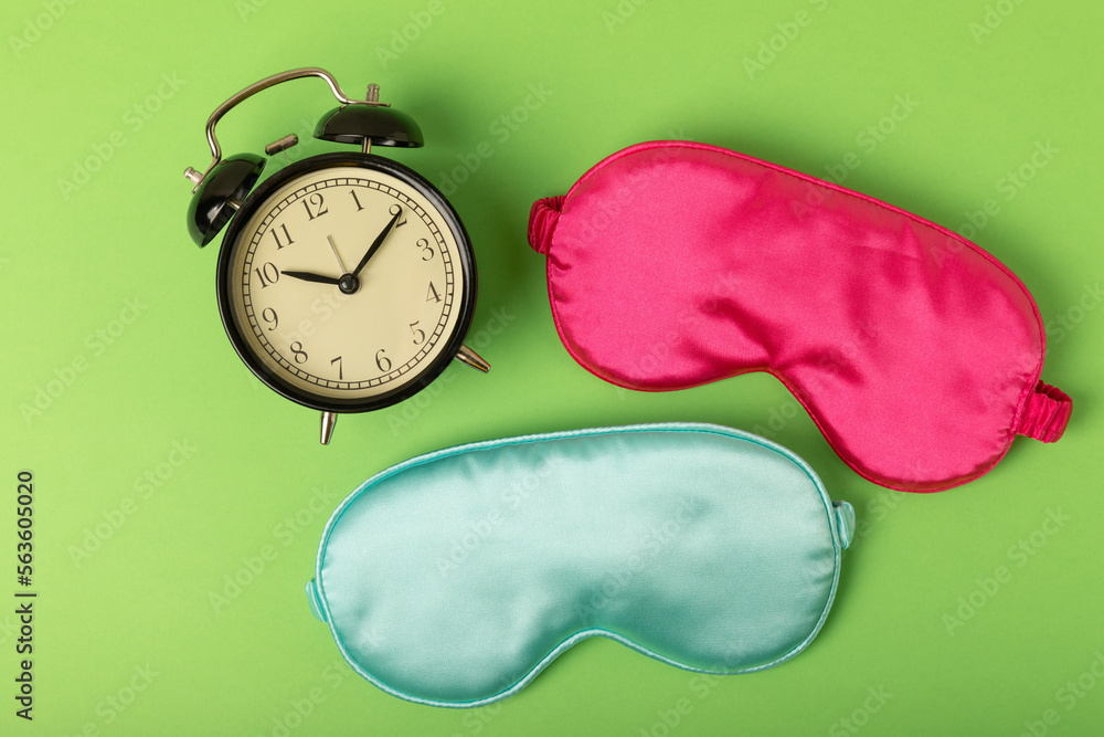 Sleeping mask on a green background. FLAT LAY. Concept of rest and quality of sleep. good night, insomnia, relaxation. Sleeping mask on a green background. FLAT LAY. Concept of rest and quality of sleep. good night, insomnia, relaxation.