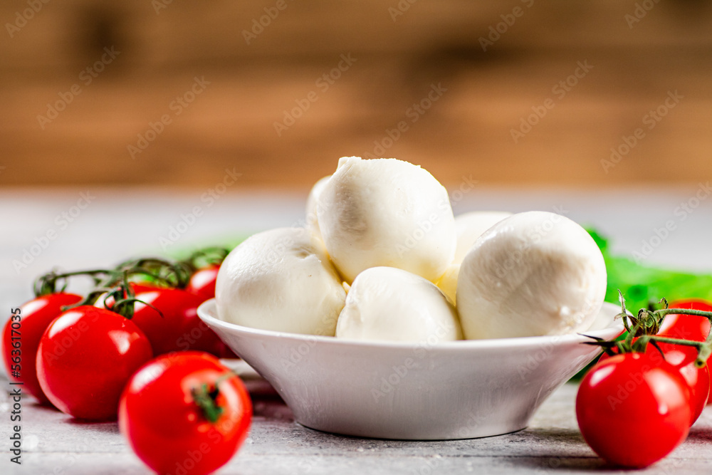 Pieces of mozzarella cheese in a plate on the table.