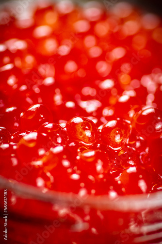 Grains of red caviar. Macro background.