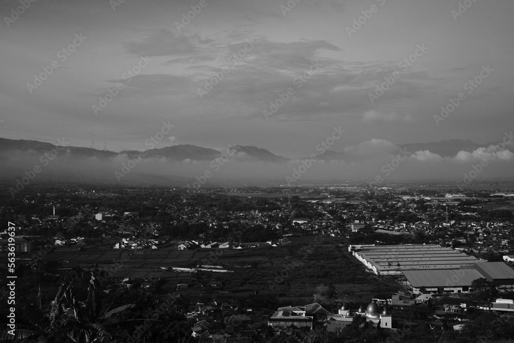 Black and white photo, Monochrome photo with landscape views of valleys and hills in the Cicalengka area - Indonesia