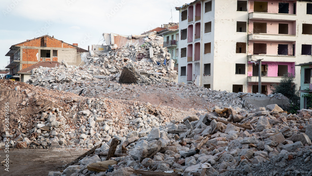 Fototapeta premium Earthquake damage in a city. Destroyed buildings after an earthquake. Selective focus included