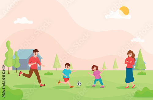 Father and children playing football together,mother standing beside,family hobby,relax time,