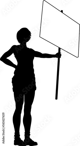 Protestor or demonstrator at a demonstration march, picket line or strike protest rally in silhouette. Holding up a banner or picket sign board placard.