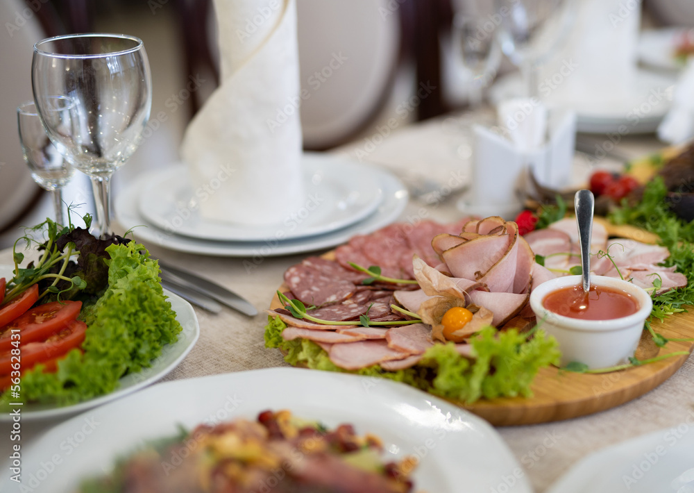 sliced ham meat sausages on the festive table. sliced ham meat sausages on the festive table.