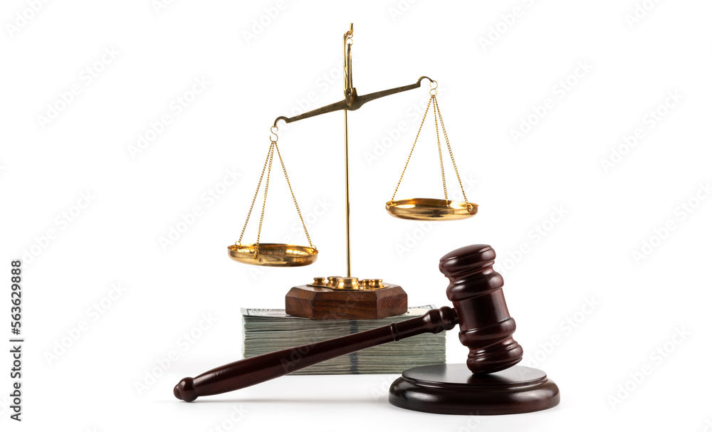Judge's gavel, golden scales and a pack of American dollars on a white background Judge's gavel, golden scales and a pack of American dollars on a white background