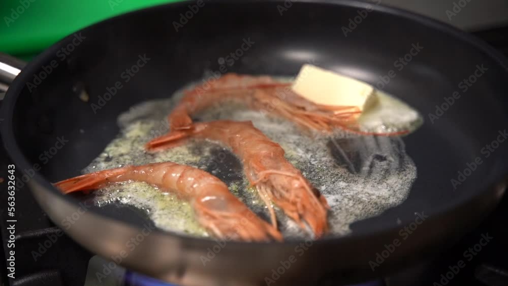 close up slow motion the shrimp is fried in a pan close up slow motion the shrimp is fried in a pan