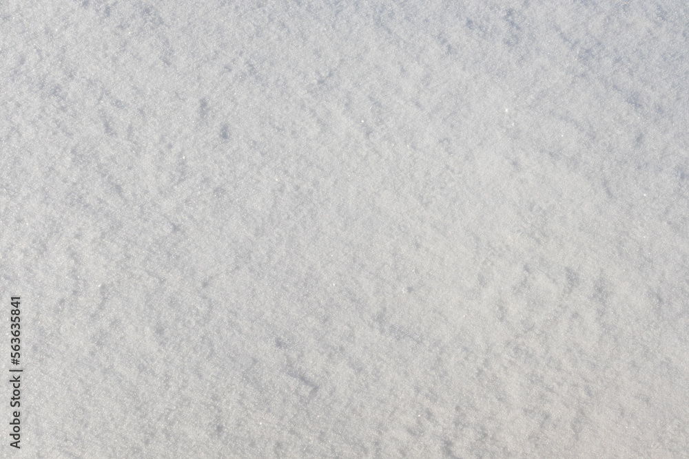 The surface of loose natural snow on a sunny day. Close up top view The surface of loose natural snow on a sunny day. Close up top view