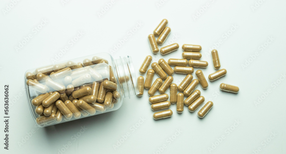 Ashwagandha pills with packaging on a white background, supplement, healthy organism, body protection Ashwagandha pills with packaging on a white background, supplement, healthy organism, body protection