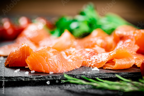 Fragrant salted salmon on a stone board. 