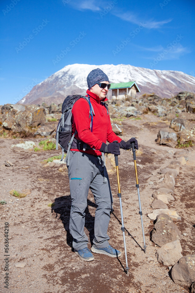 Male backpacker on the trek to Kilimanjaro mountain.