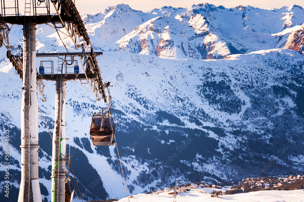 Gondola lift in ski resort in winter Alps mountains, France. Meribel, France.