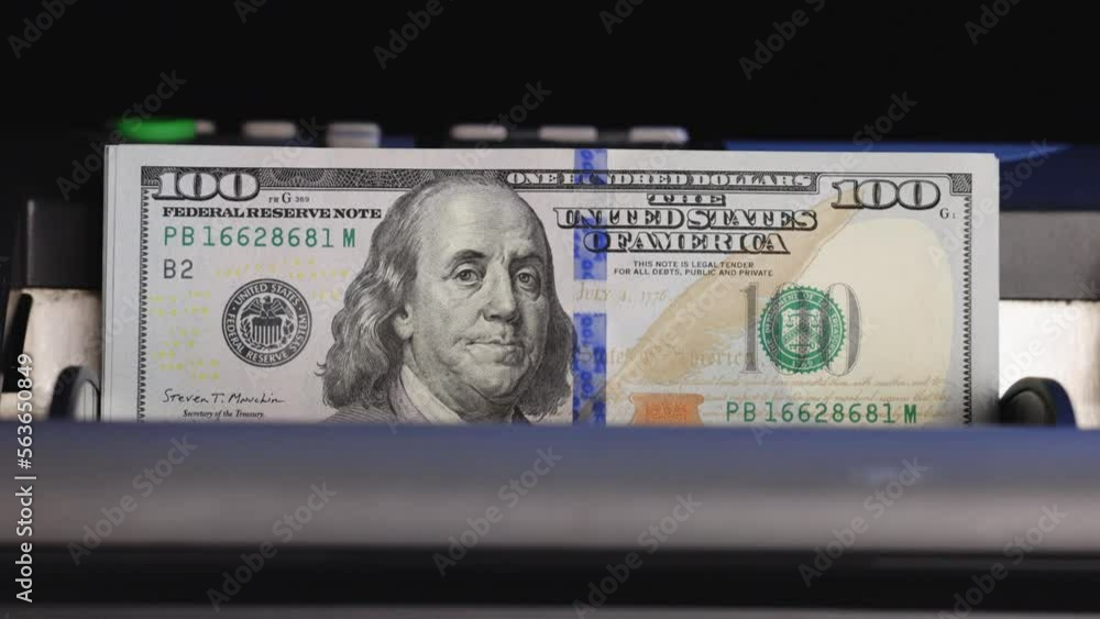 Bill Counting Machine Counting Cash of 100 Dollar Bills. American