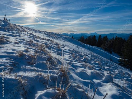 Lengries, Germany - December 28th 2022: A snow covered slope in the Bavarian Alps in the afternoon sunlight photo