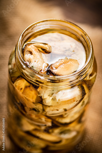 Pickled mussels in a glass jar. 