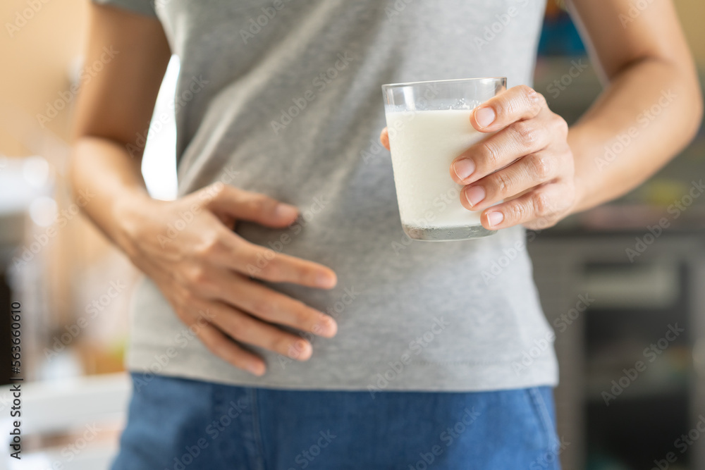 Pain, suffering asian young woman having a stomachache, abdominal pain