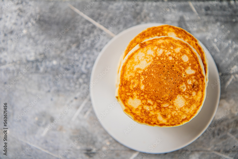Pancakes in a plate on the table. Pancakes in a plate on the table.