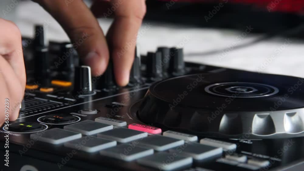 Hands of a Man working with DJ Mixer or Sound Mixing Deck. Close Up. Hands of a Man working with DJ Mixer or Sound Mixing Deck. Close Up.