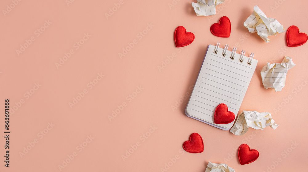 Notebook with hearts and crumpled letters with drafts on a light background. Valentine concept. Confession of love. Flat lay, top view. Copy space. Notebook with hearts and crumpled letters with drafts on a light background. Valentine concept. Confession of love. Flat lay, top view. Copy space.