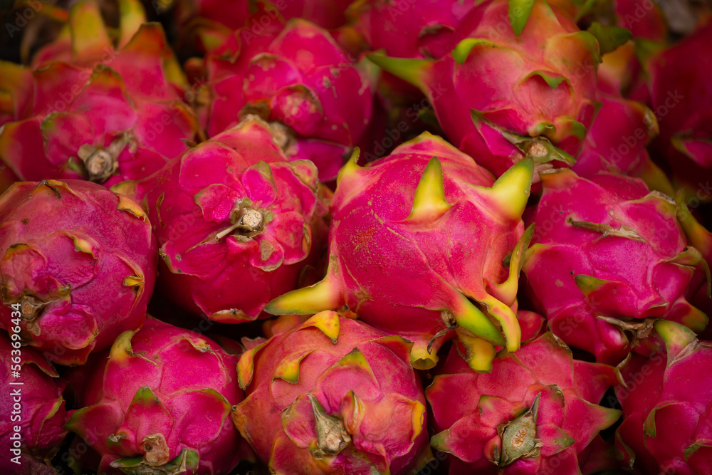Tropical dragon eye fruit bunch. Pitahaya close-up as a background. Tropical dragon eye fruit bunch. Pitahaya close-up as a background.