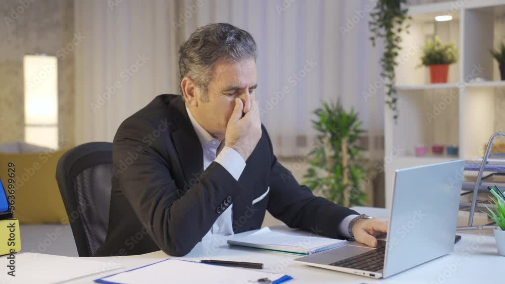 Mature businessman annoyed because he is having trouble with laptop. System error, erroneous e-mail, negative news, unsaved, negative e-mail, rejection. Mature businessman annoyed because he is having trouble with laptop. System error, erroneous e-mail, negative news, unsaved, negative e-mail, rejection.