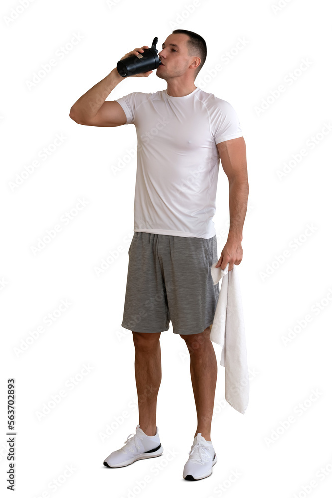 Very fit and sporty man standing and drinking water after workout isolated on white background Very fit and sporty man standing and drinking water after workout isolated on white background