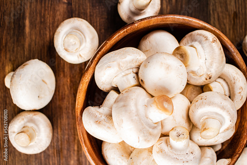 Fresh mushrooms in a wooden bowl. 