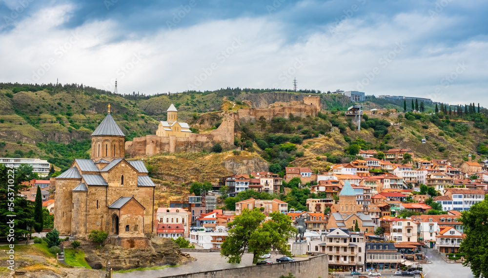 Tbilisi old town with Metekhi church, Narikala Fortress on hill and sulfur baths district. Tiflis with ancient architecture is popular tourist destination in Georgia