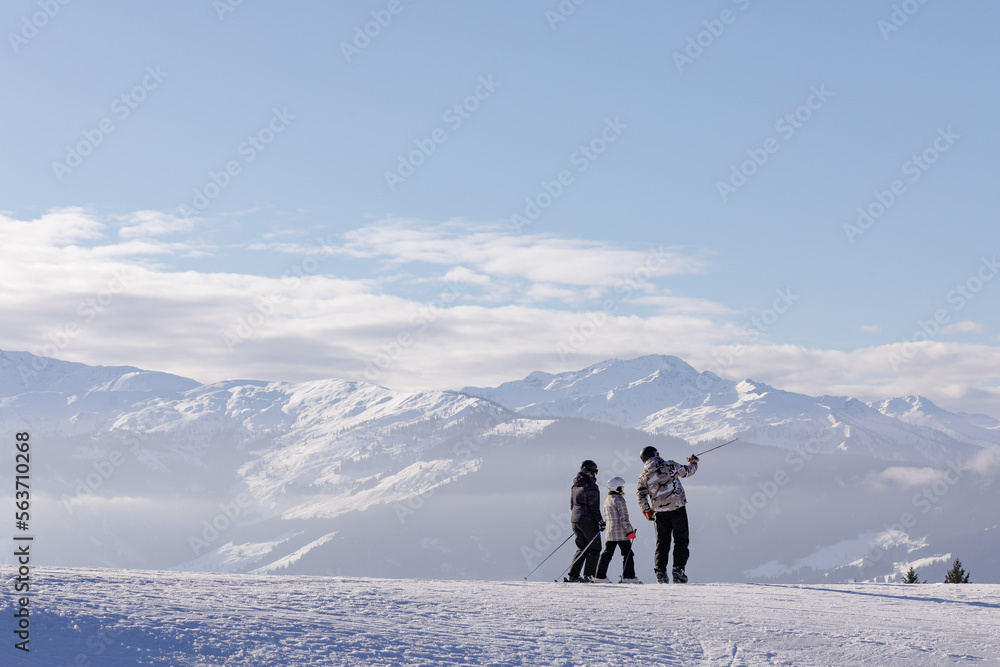 man and woman skiing and snowboarding in the mountains, ski resort