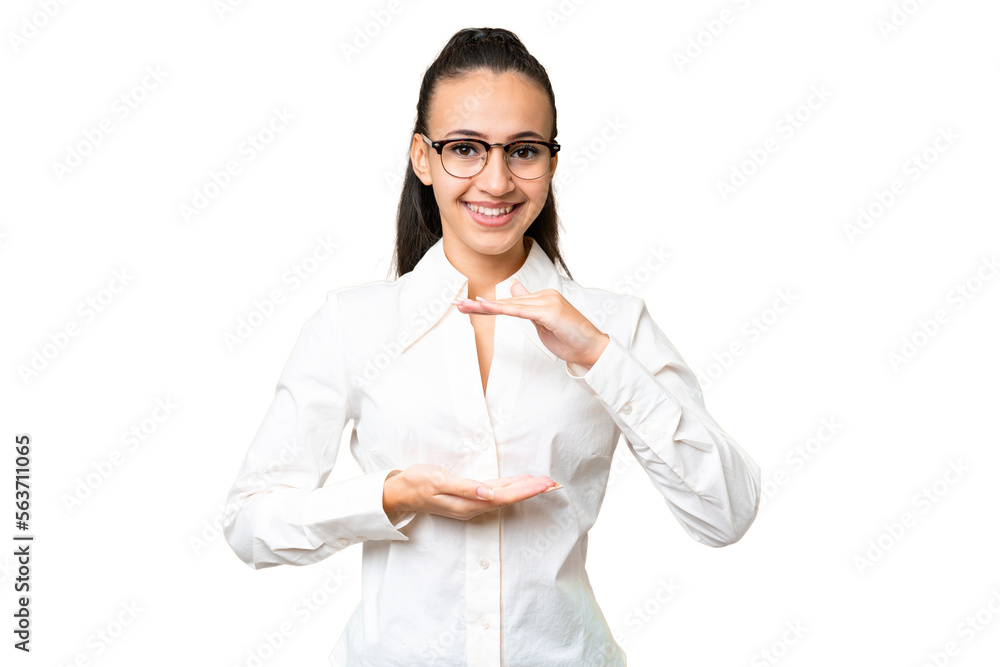 Young Arabian woman over isolated chroma key background holding copyspace imaginary on the palm to insert an ad Young Arabian woman over isolated chroma key background holding copyspace imaginary on the palm to insert an ad
