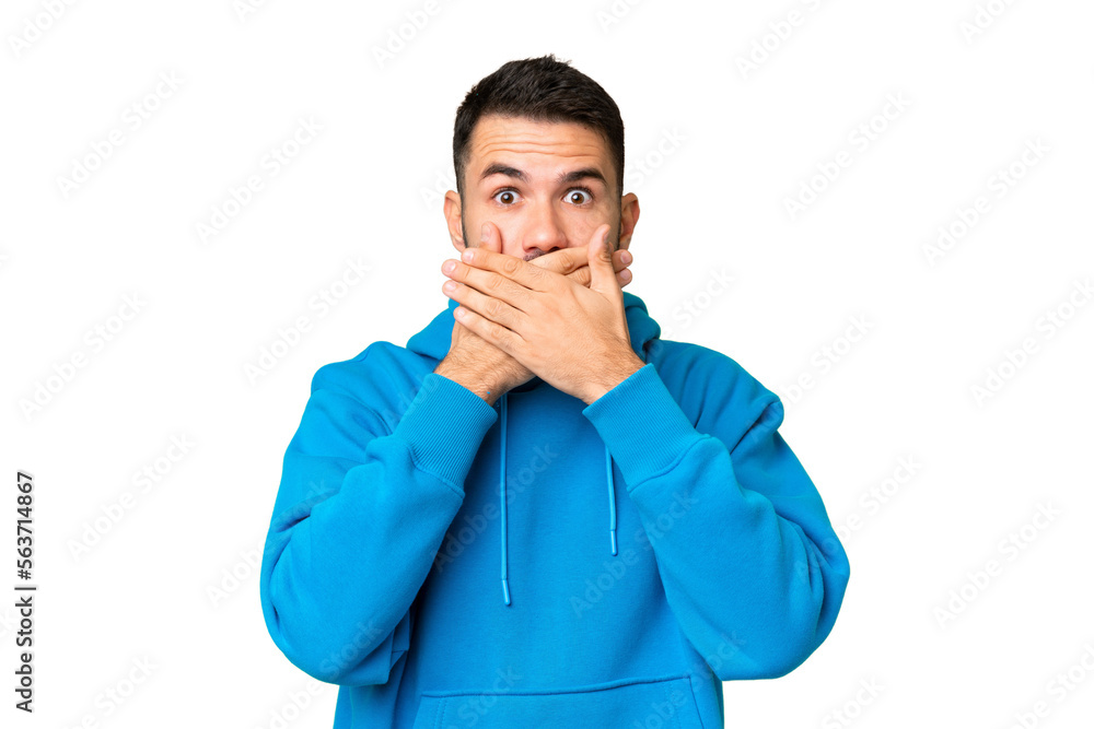 Young handsome caucasian man over isolated chroma key background covering mouth with hands Young handsome caucasian man over isolated chroma key background covering mouth with hands