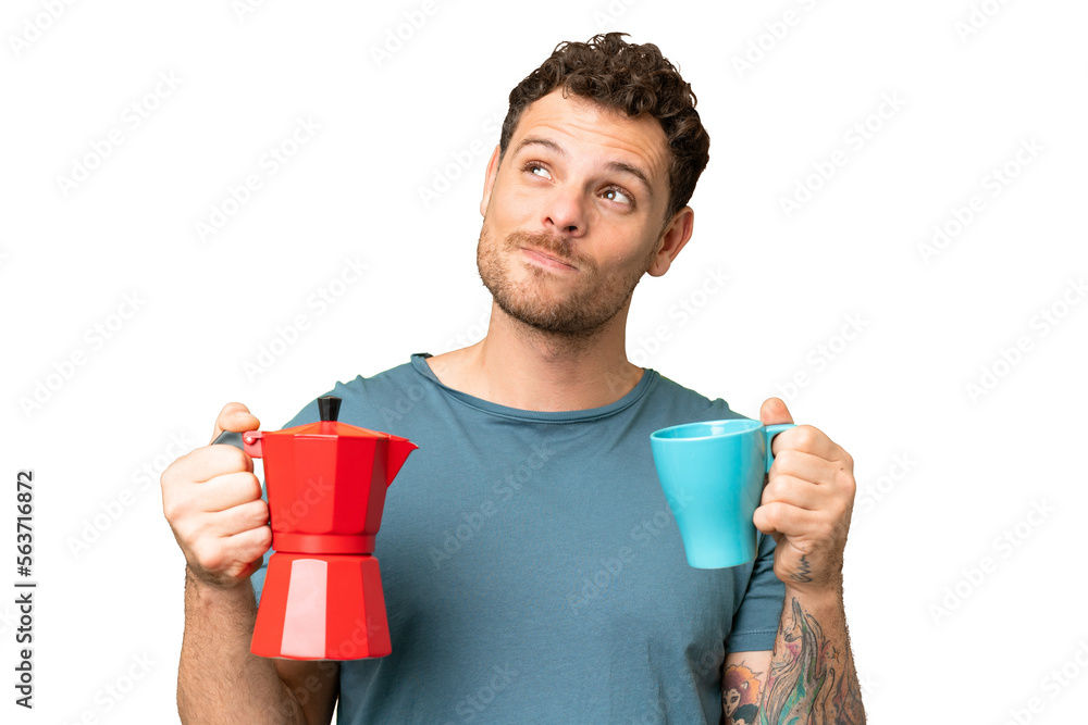 Brazilian man holding coffee pot over isolated chroma key background Brazilian man holding coffee pot over isolated chroma key background