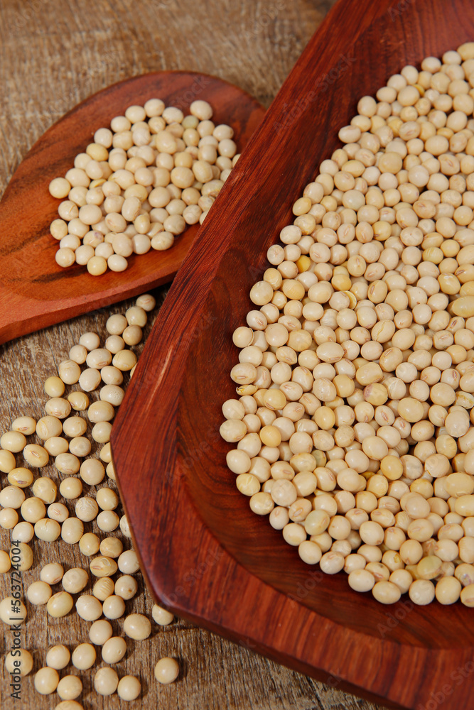 Fototapeta premium Soya beans closeup on wooden platter. Brazil