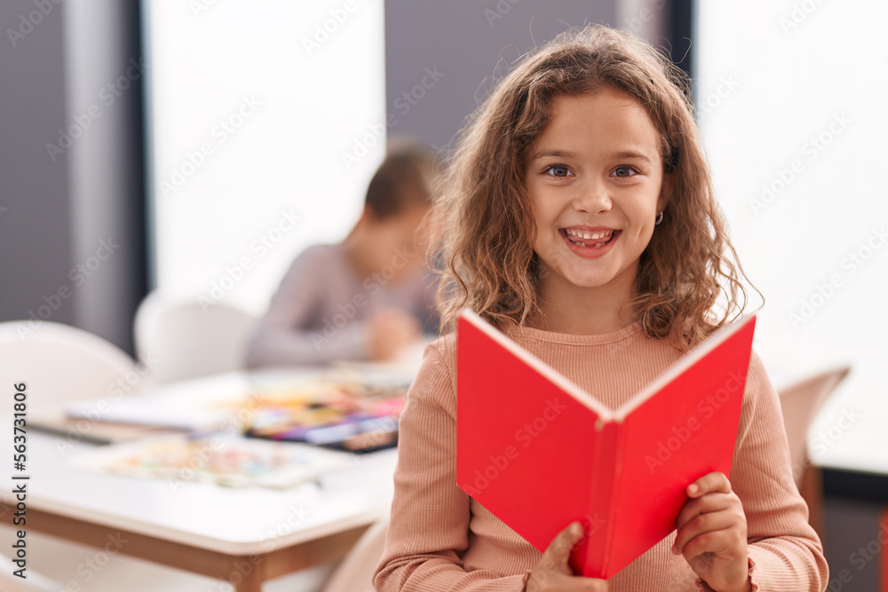 Two kids students reading book studying at classroom Two kids students reading book studying at classroom
