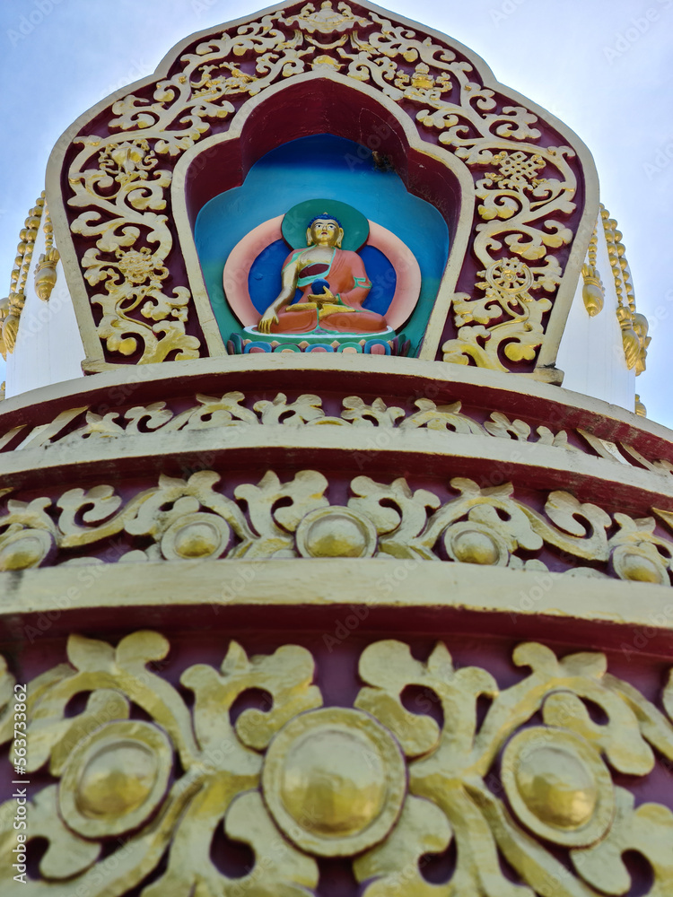 buddhist stupas for meditation ornamented with buddha and golden designs