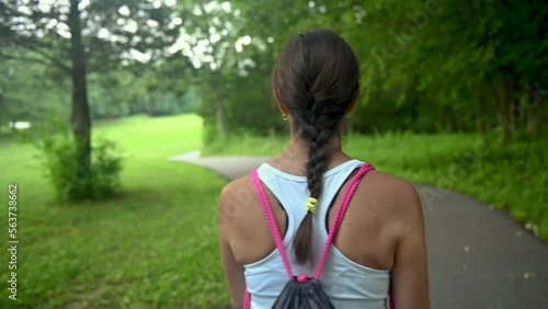 woman hiking in a par