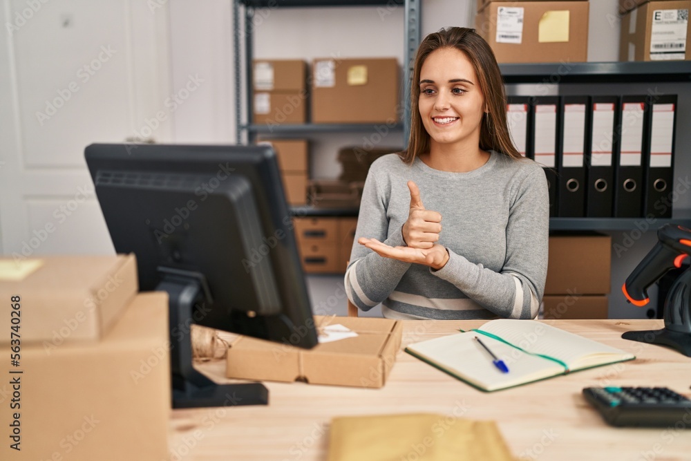 Young blonde woman ecommerce business worker having online deaf language conversation at office Young blonde woman ecommerce business worker having online deaf language conversation at office