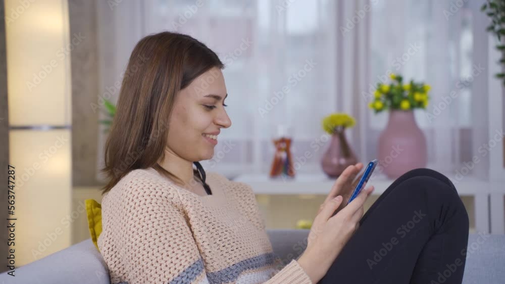 Beautiful young woman using smartphone at home smiling happily.
Young woman holding smartphone having fun using mobile apps laughing at mobile phone screen.
Beautiful young woman using smartphone at home smiling happily.
Young woman holding smartphone having fun using mobile apps laughing at mobile phone screen.