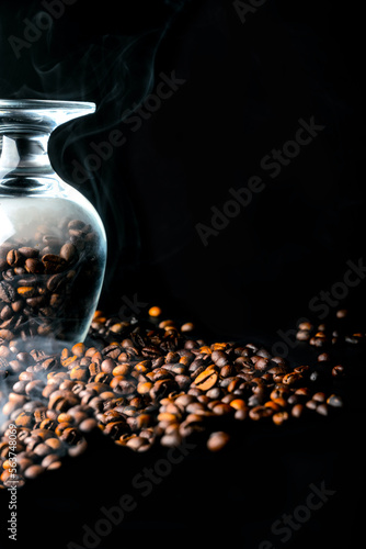 Freshly roasted coffee beans on a black background